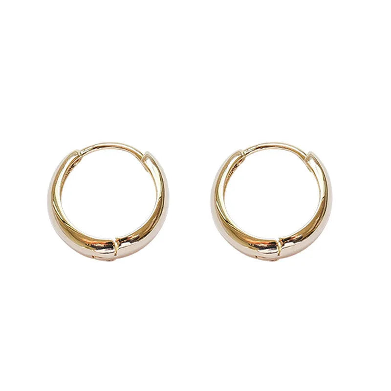 Women's minimalist geometric water drop earrings in gold and silver, shown in large, medium, and small sizes.