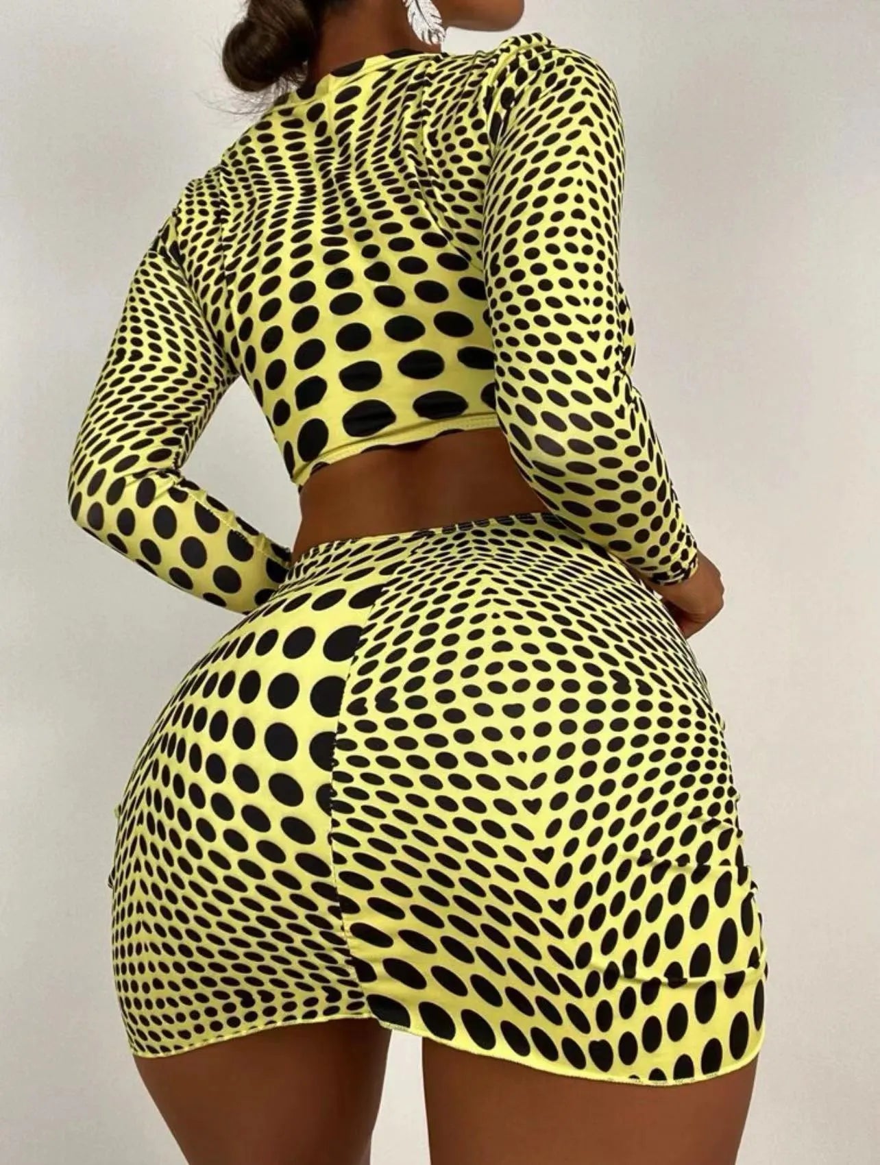 Women's green polka dot three-piece swimsuit set showing top, skirt, and bra