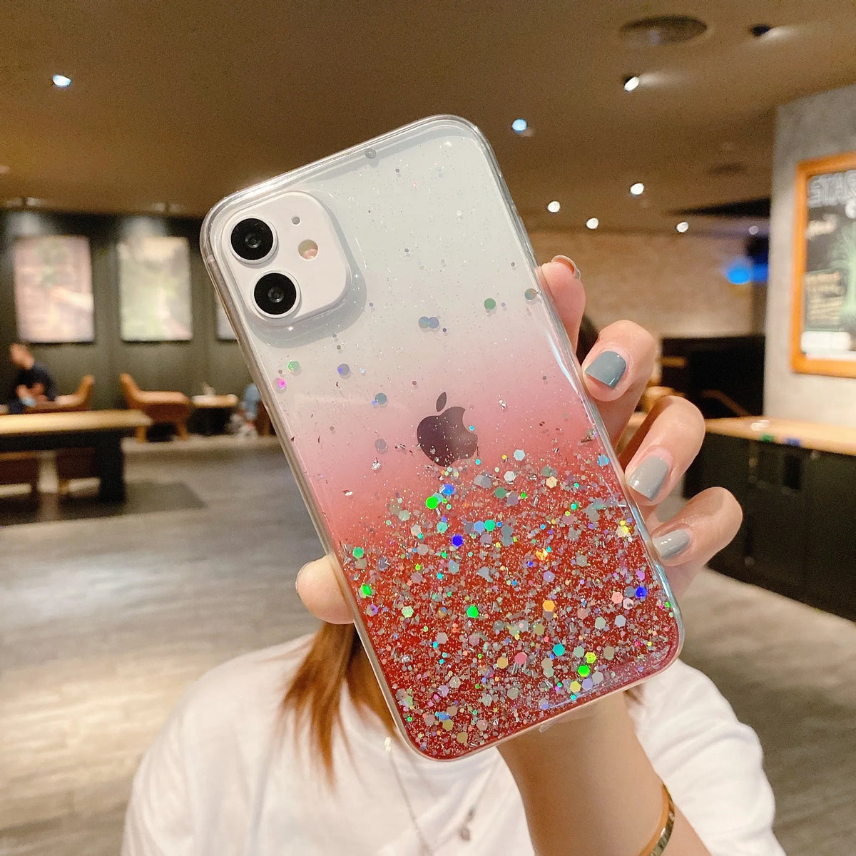 Transparent glitter epoxy iPhone case for iPhone 11 and 12 series showing embedded glitter paper design
