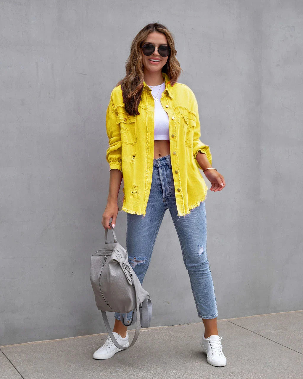 Stylish ripped denim jacket for trendy women in a variety of vibrant colors