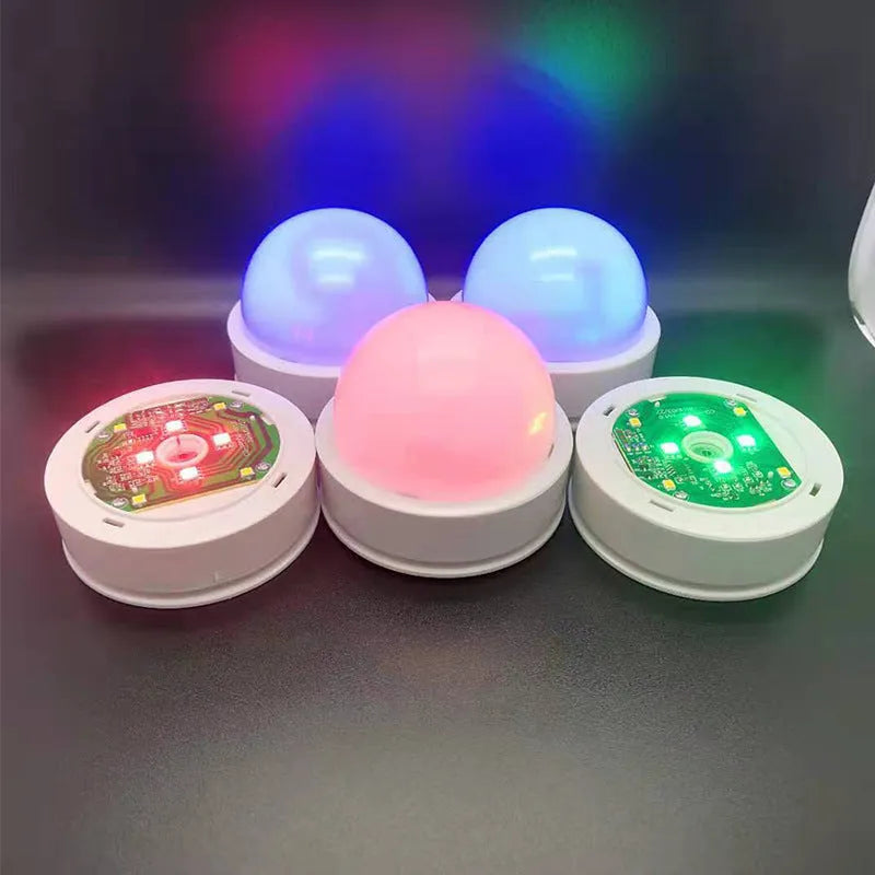 Colourful gradient 3D shooting light with remote control and touch activation on black background
