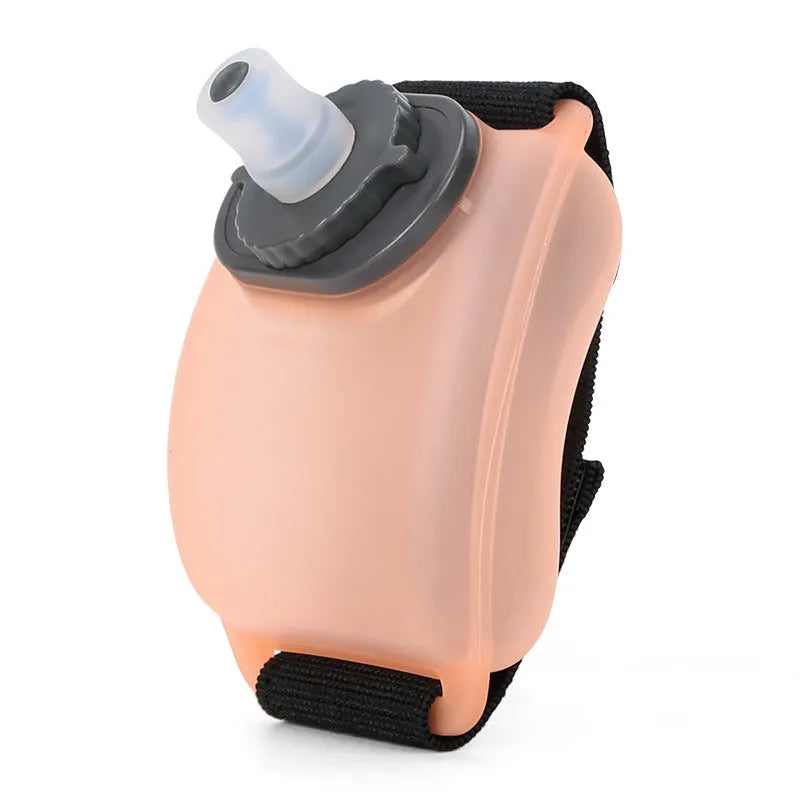 Orange wrist water bottle with Velcro strap showing 200ml capacity and silicone mouthpiece
