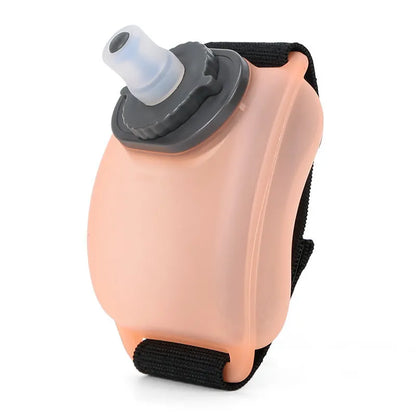 Orange wrist water bottle with Velcro strap showing 200ml capacity and silicone mouthpiece