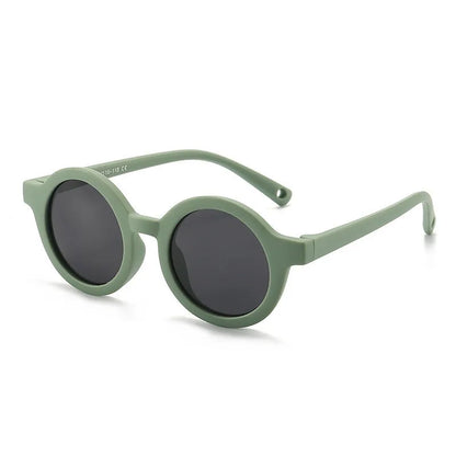 Children's round-frame polarised sunglasses with soft TPEE frame for ages 0-3, shown in assorted colours.