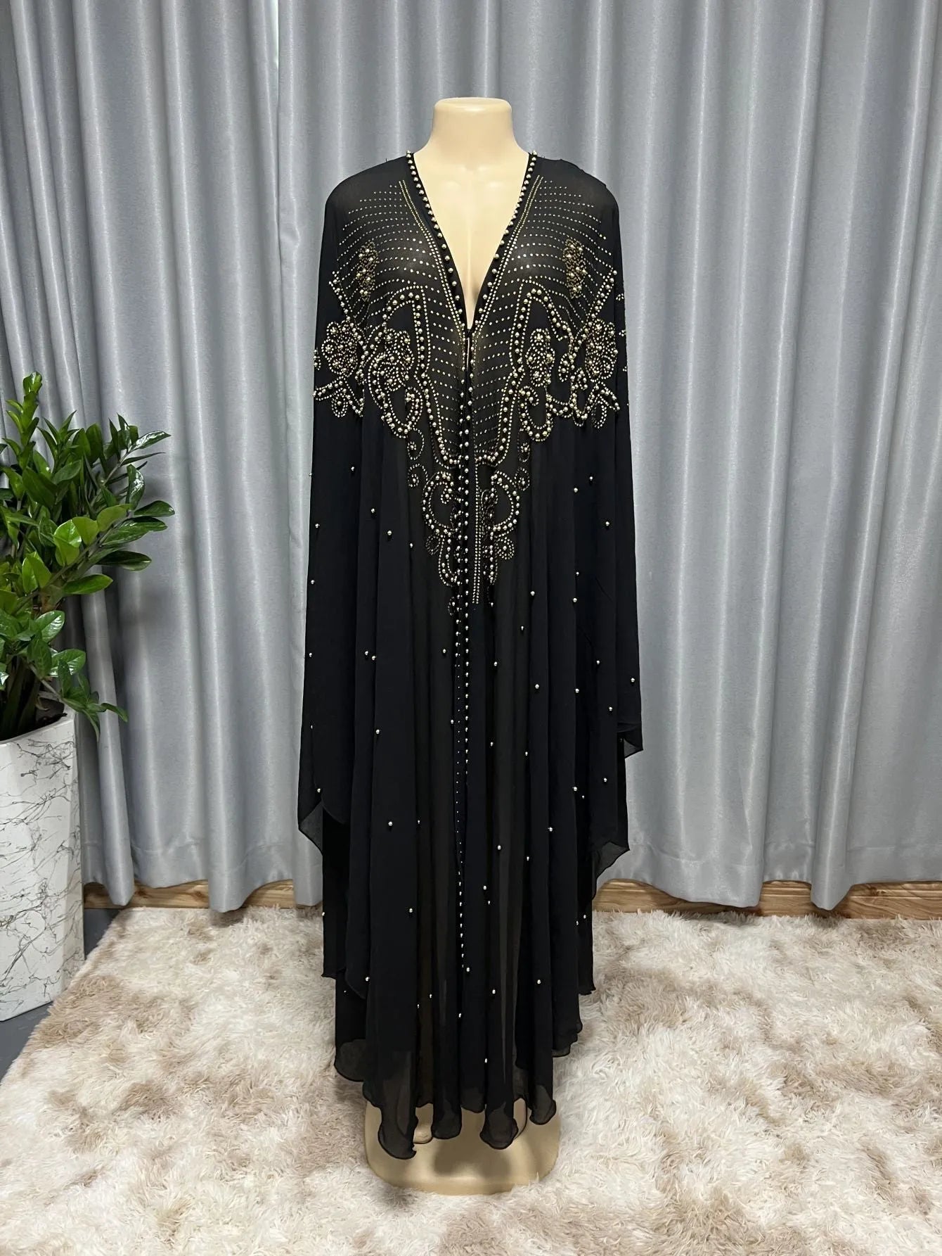 Purple chiffon Muslim style shawl with rhinestone beaded trim laid flat showing its long length.