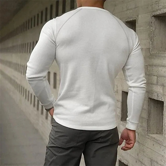 Men's white long-sleeved t-shirt with a Henry collar laying flat