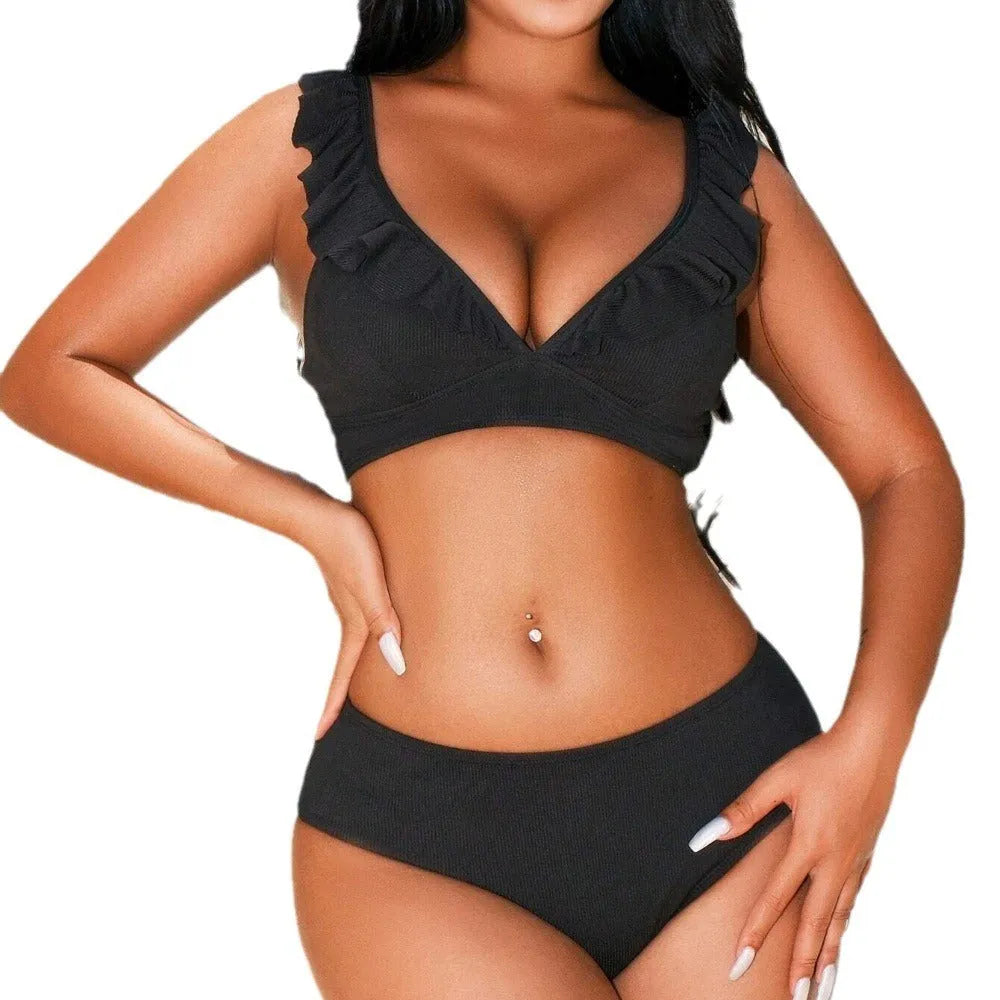 Women's retro striped split chest bikini swimsuit on a hanger