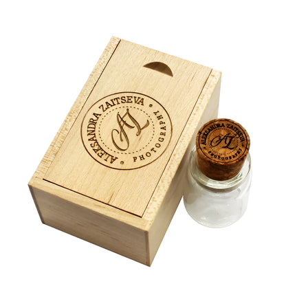 Chocolate brown wooden USB flash drive shaped like a drift bottle with custom engraved lettering on the side