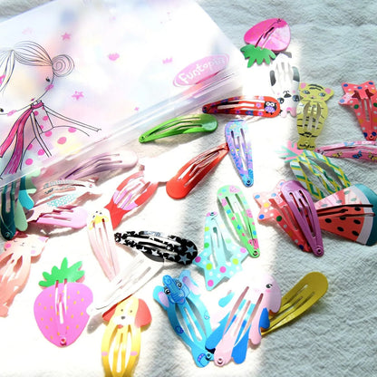 Assortment of 100 hair clips with cartoon designs including animals, fruits, crowns and stars in bright colours