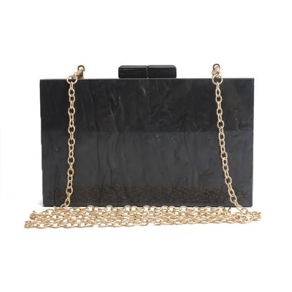 Small square acrylic clutch bag with long chain, marble pattern, and internal phone pocket