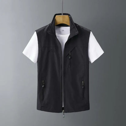 Man wearing a slim-fit hooded waistcoat made of rabbit fur in a casual outdoor setting.