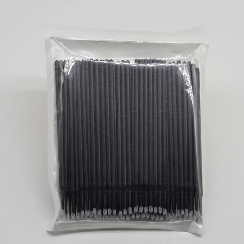 Disposable micro applicator brushes with coloured plastic handles and bendable cotton swab tips