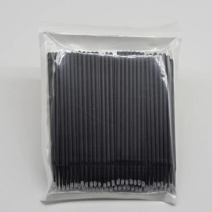 Disposable micro applicator brushes with coloured plastic handles and bendable cotton swab tips