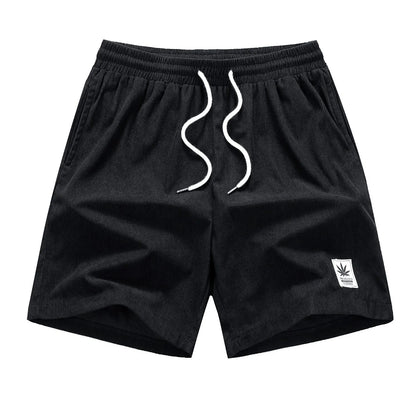 Men's straight-cut drawstring shorts in blue, shown on a model for summer casual wear.