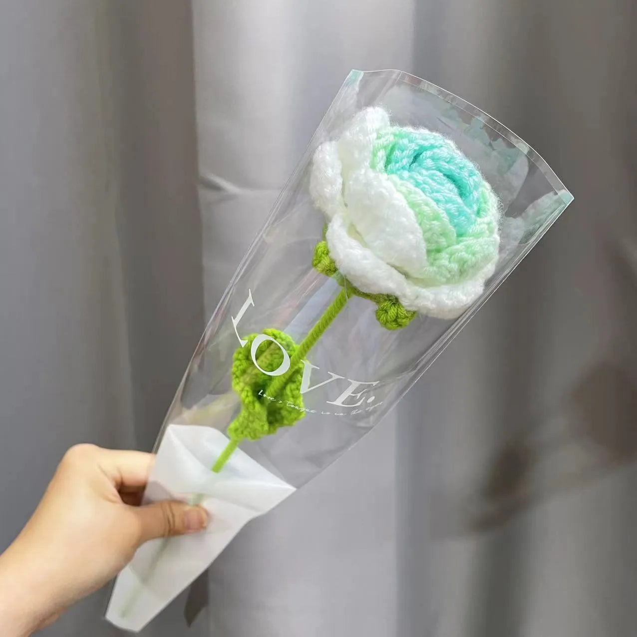 Wool-woven artificial silk rose bouquet in gradient blue colour with textured floral arrangement