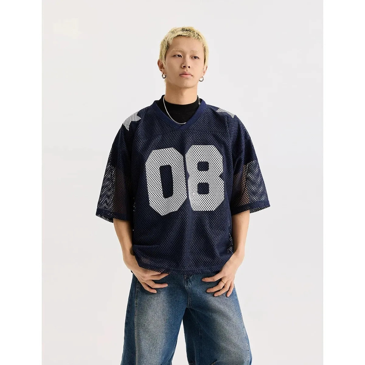 Black half sleeve loose fit shirt with white letter print, short sleeves, pullover style.