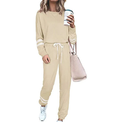 Women's loose-fitting plus size casual suit in a cotton blend, shown in a solid colour with a half-sleeve top and trousers.