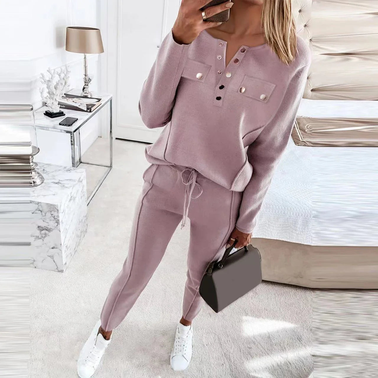Cozy two-piece loungewear set for women in solid colors, featuring a crewneck top and drawstring-waist pants