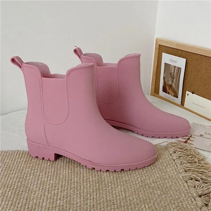 Pair of short casual PVC rain boots with non-slip sole and 3-5cm mid heel, shown in pink, milky white, and black