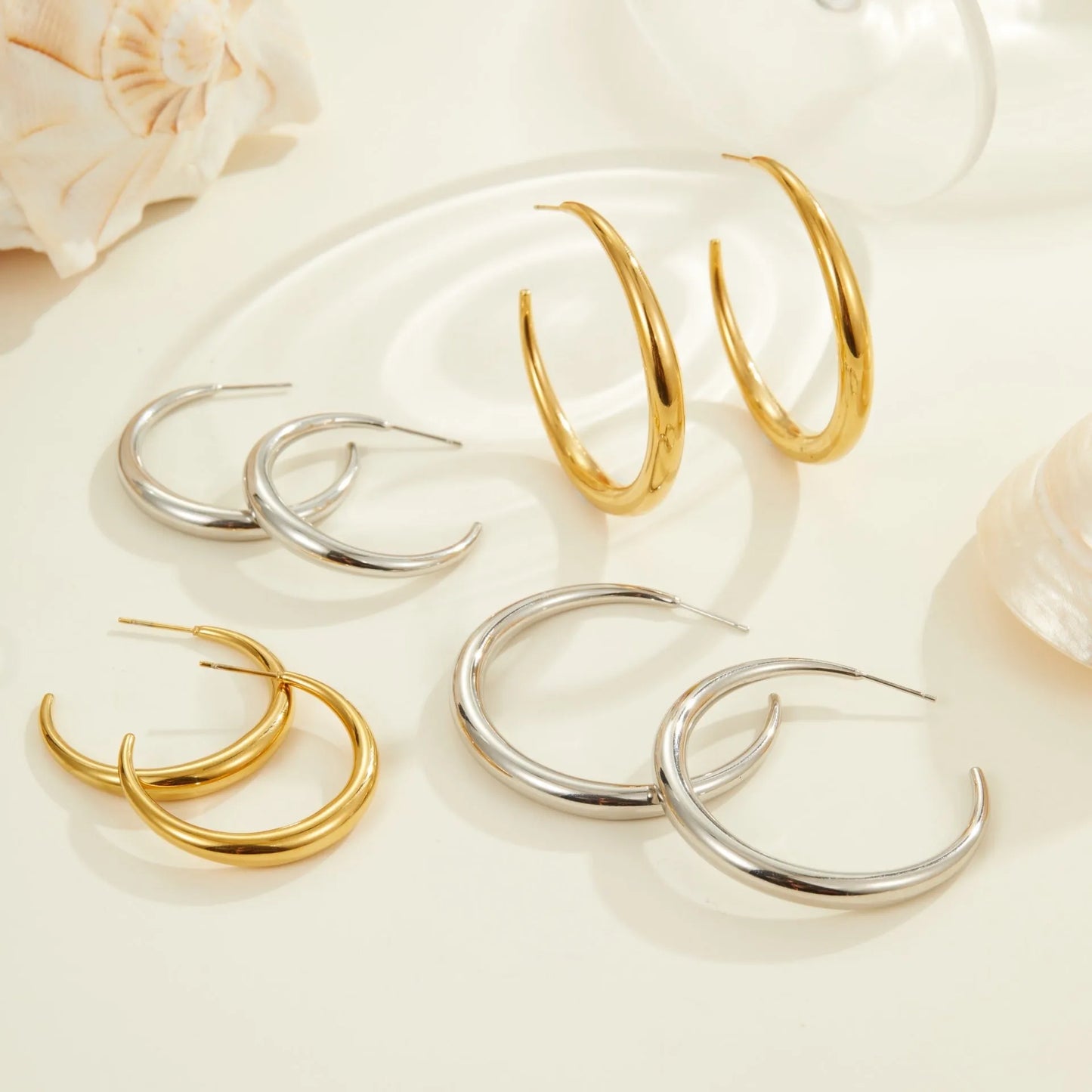 Titanium steel geometric round hoop earrings with 18K gold plating available in large and small sizes