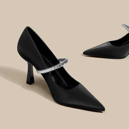 Black women's stiletto sandals with pointed toe and buckle strap closure