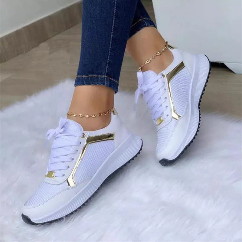 Women's lace-up sports sneakers with breathable mesh upper in black, white, and apricot
