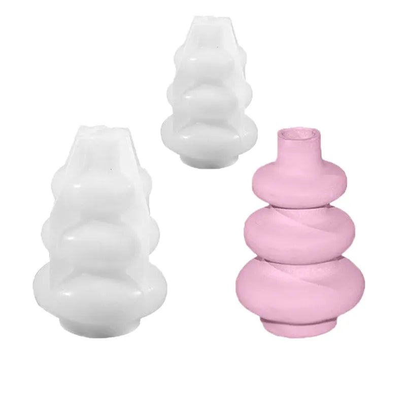 Silicone baking mould in shape of three-layer irregular circle vase on white background