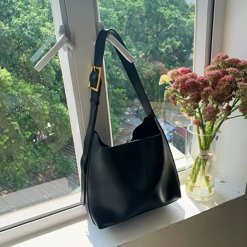 Women's soft PU shoulder bag measuring 28cm by 32cm by 12cm with swing thread details