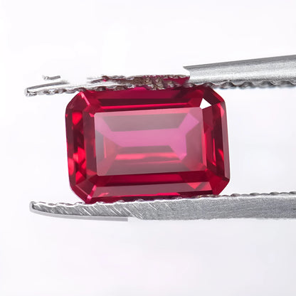 Synthetic pigeon blood red ruby gemstone showing egg shape, round, and princess square cuts