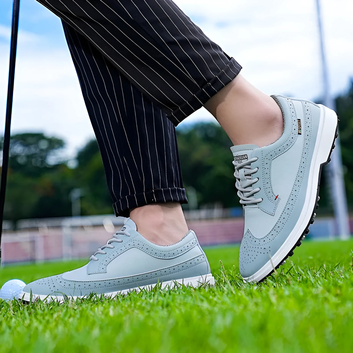 Men's lightweight golf shoe in lake blue with genuine leather upper and non-slip rubber sole.