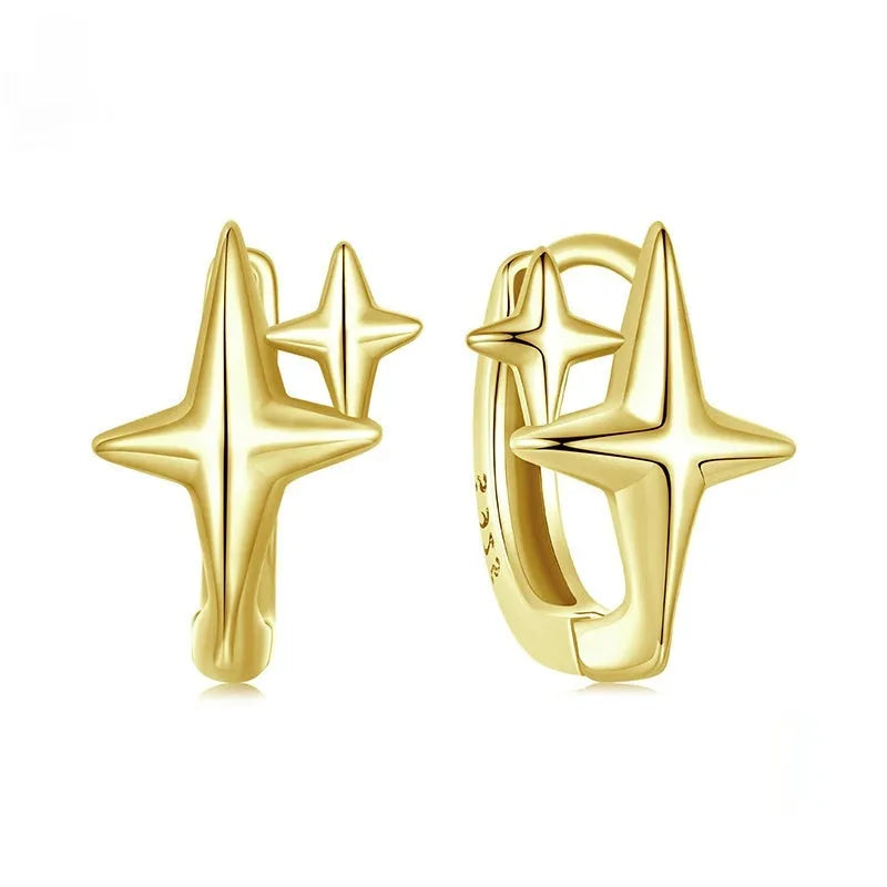 Sterling silver minimalist star ear clip with oxidised finish and XINGX design detail.