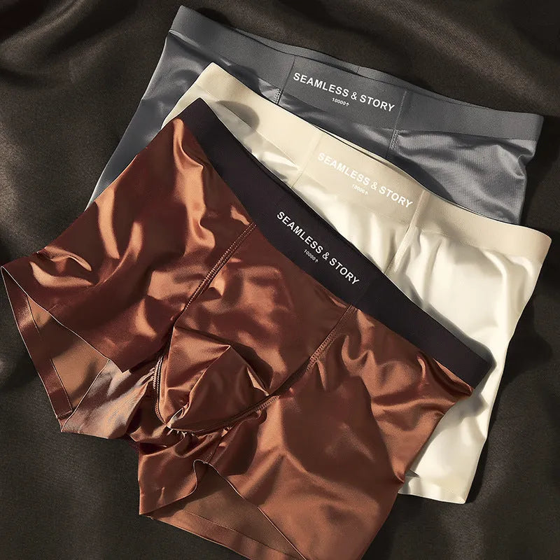 Men's solid colour satin ice silk boxer shorts laid flat, showing mid-waist design.