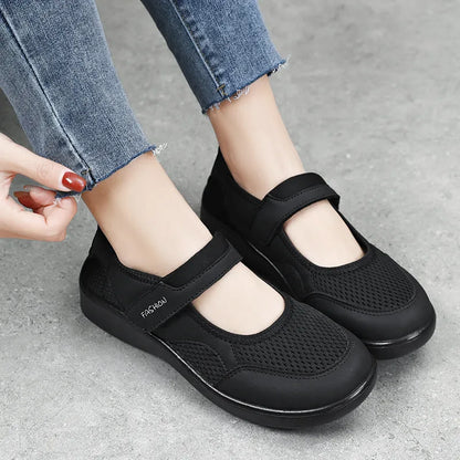 Women's breathable mesh casual shoes in black with Velcro closure and round toe design