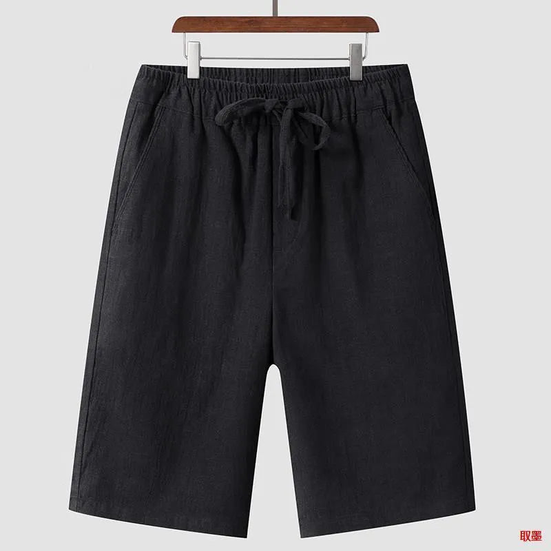 Men's beige linen casual shorts with a loose fit and elastic waistband on a neutral background.