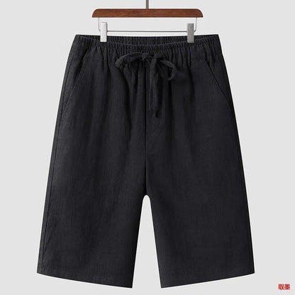 Men's beige linen casual shorts with a loose fit and elastic waistband on a neutral background.