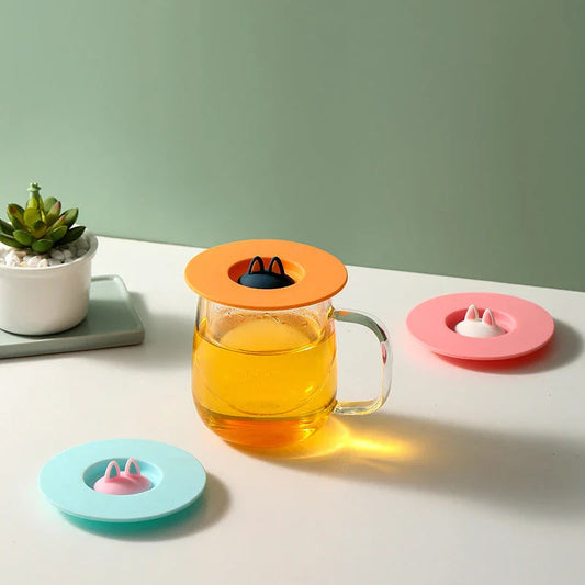 Charming cat ear silicone sealing lid in vibrant colours, designed to keep drinks fresh and prevent spills