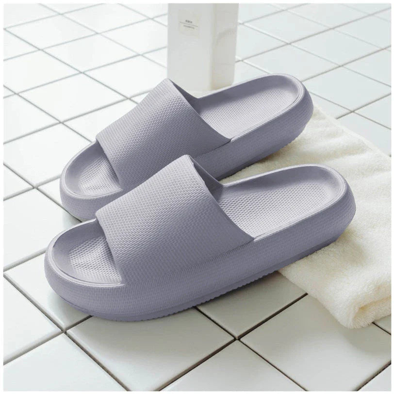Cozy slip-on slippers in various colors for men and women, featuring soft fabric upper and non-slip EVA soles