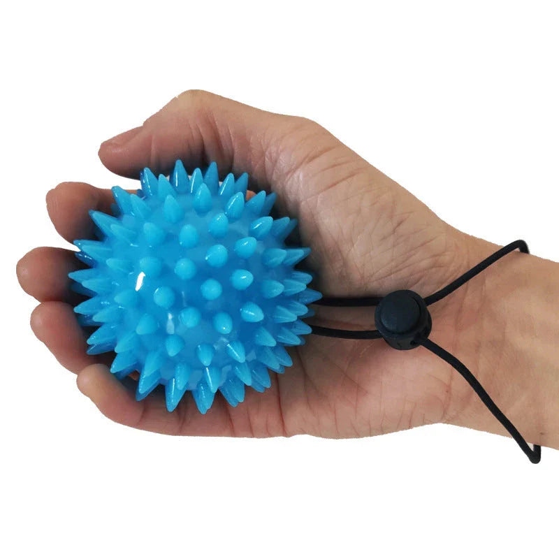 Therapeutic hand grip massager with massage bumps and finger holes for improving grip strength and relaxing hand muscles