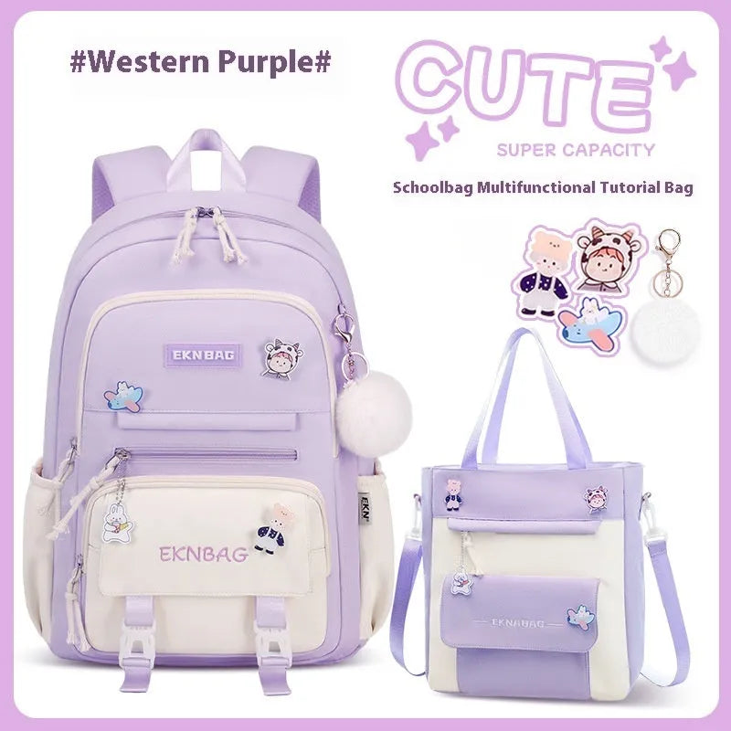 Pink waterproof Oxford cloth school backpack for girls with curved straps on a bookshelf.
