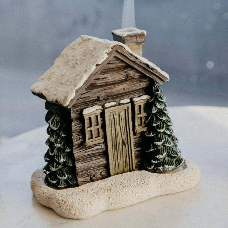 Rustic log cabin incense burner with intricate details, filling the air with soothing aromas