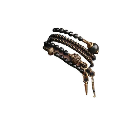 Black geometric beaded bracelet with multi-layered colourful design on wrist