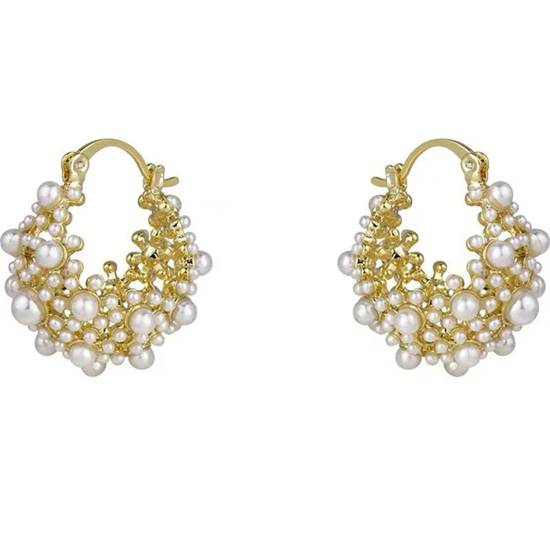 Gold-coloured women's floral basket earrings made from copper with small bead and pearl inlay detail.