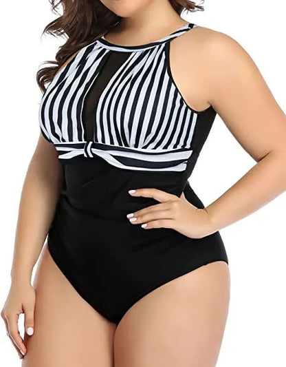 Women's black one-piece swimsuit with lace trim on display, showing front design and fabric detail.