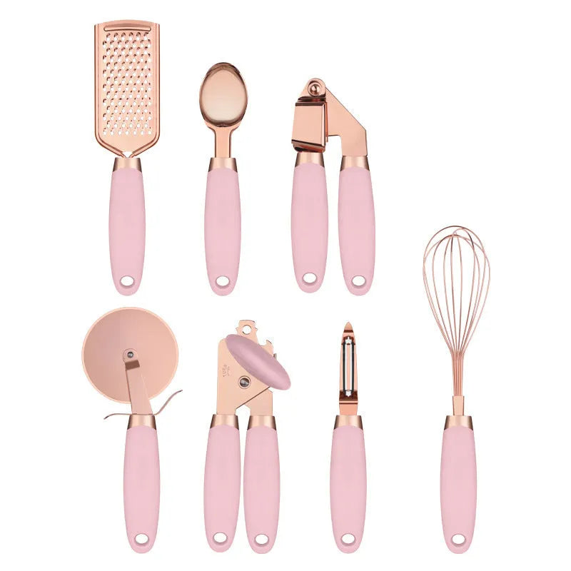 7-piece stainless steel kitchen tool set with copper finish on a countertop storage rack.