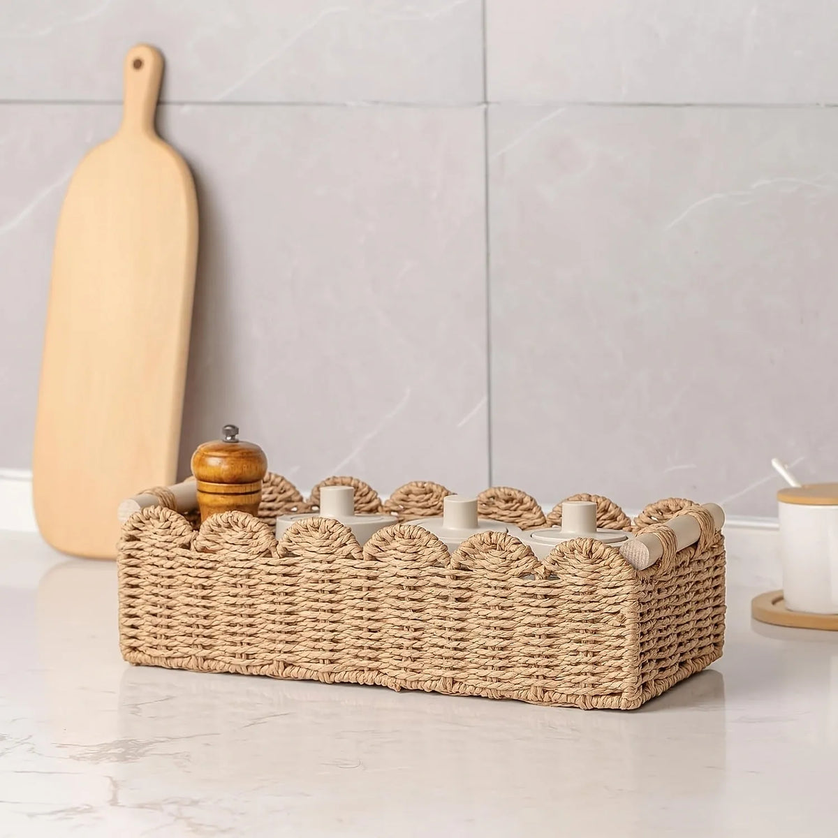 Woven paper storage basket in khaki colour, dimensions 35.5x16x10cm, on a desktop with remote controls and stationery