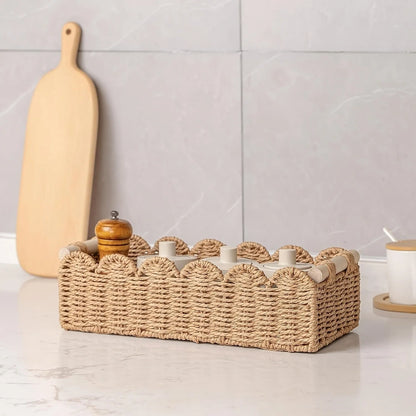 Woven paper storage basket in khaki colour, dimensions 35.5x16x10cm, on a desktop with remote controls and stationery