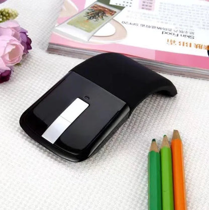 Folding wireless touch mouse showing compact design with Bluetooth connectivity
