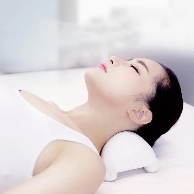 Black and white cervical health pillow using ABS material for physical traction, measuring 24x14.5x10 cm
