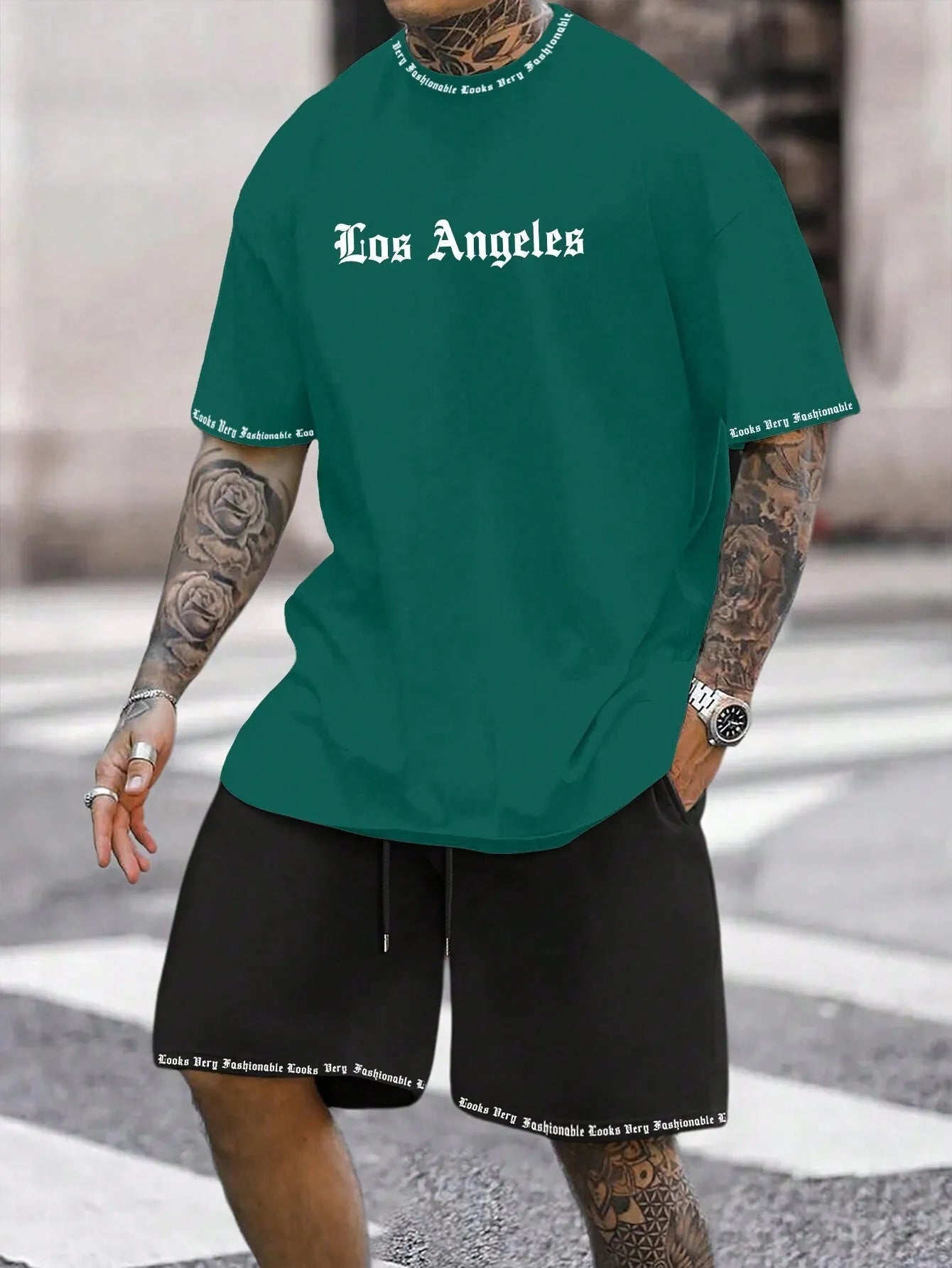 Man wearing a printed short-sleeve sports top and matching shorts in a quick-dry polyester blend.