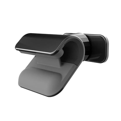 Black universal car phone holder with 360-degree rotation mounted on a car dashboard, holding a mobile phone.